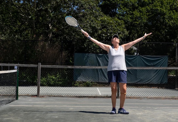 Judy plays tennis in the Provincetown sunshine